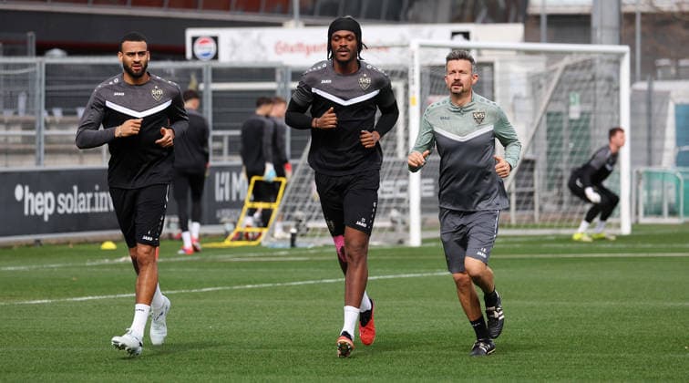 1103 2026, Germany, Stuttgart, Football VfB Stuttgart Training, f l Josha Vagnoman VfB , Dan Axel Zagadou VfB , Physio Martin Franz In accordance with the regulations of the DFL German Football League, it is prohibited to use or have used photographs taken in the stadium and or of the match in the form of sequential images and or video-like photo series
