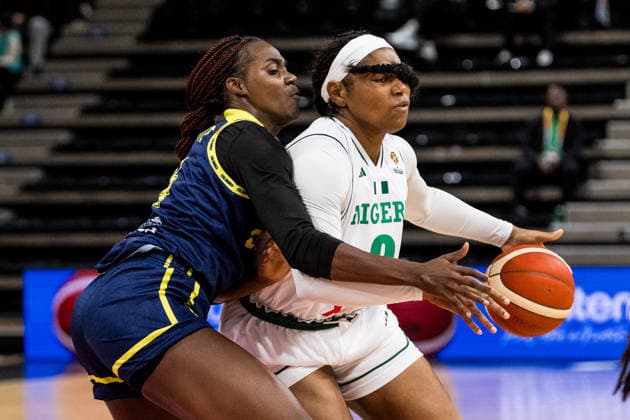 LYON-VILLEURBANNE, FRANCE - MARCH 11: Amy Okonkwo (Nigeria, 0) controls the ball against Marlyn Vente (Colombia, 14) during the FIBA Women™s World Cup Qualifying Tournament match between Nigeria vs. Colombia at Astroballe on matchday 1 of the FIBA Women™s World Cup Qualifying Tournament on March 11, 2026 in Lyon-Villeurbanne, France. France Copyright: xSteffiexWunderlx