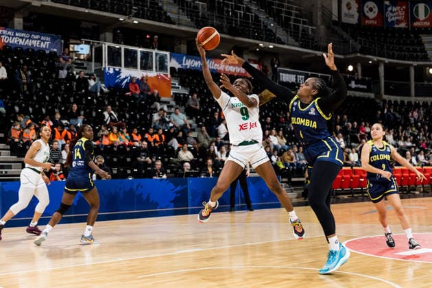 LYON-VILLEURBANNE, FRANCE - MARCH 11: Ifunanya Okoro (Nigeria, 9) shoots the ball against Yuliany Paz (Colombia, 6) during the FIBA Women™s World Cup Qualifying Tournament match between Nigeria vs. Colombia at Astroballe on matchday 1 of the FIBA Women™s World Cup Qualifying Tournament on March 11, 2026 in Lyon-Villeurbanne, France. France Copyright: xSteffiexWunderlx