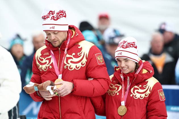 ITALY, TESERO - MARCH 11, 2026: Gold medalists Anastasia Bagiian and guide Sergei Siniakin of Russia attend a victory ceremony for the women s para cross-country skiing 10km interval start classic vision impaired at Tesero Cross-Country Stadium during the 2026 Winter Paralympic Games 2026 Winter Paralympics: Para Cross-Country Skiing  - ZUMAt113 20260311_zaa_t113_259 Copyright: xMikhailxTereshchenkox