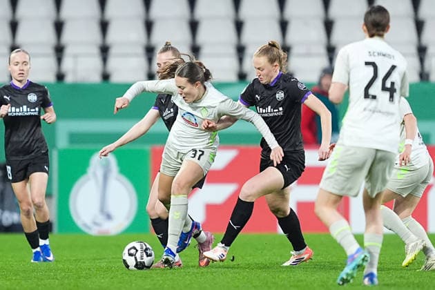 11 03 2025, xydrx, Football, DFB Cup quarter-final women, SGS Essen SV Werder Bremen, Season 2025 2026, Stadion an der Hafenstraße Mara Alber SV Werder Bremen, 37 in a duel against Maike Berentzen SGS Essen, 13 and Laura Pucks SGS Essen, 15 DFB regulations prohibit any use of photographs as image sequences and or quasi video Copyright: HMBxMedia YannisxDreimann