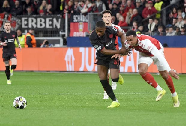 11 03 2026, xhbx, Football UEFA Champions League, Bayer 04 Leverkusen FC Arsenal London v l Christian Kofane Bayer Leverkusen , Gabriel Magalhaes Arsenal London FC DFL DFB REGULATIONS PROHIBIT ANY USE OF PHOTOGRAPHS as IMAGE SEQUENCES and or QUASI VIDEO Leverkusen