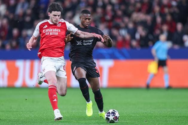 Soccer Champions League Round of 16 Bayer 04 Leverkusen FC Arsenal on 11 03 2026 at the BayArena in Leverkusen Declan Rice Arsenal , left Christian Kofane Leverkusen , right xJRx