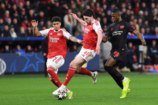 Piero Hincapie Hincapià FC Arsenal , Declan Rice FC Arsenal and Christian Kofane Bayer 04 Leverkusen in a duel during the UEFA Champions League 2025 26 Round of 16, First Leg, match between Bayer 04 Leverkusen and FC Arsenal, BayArena on March 11, 2026 in Leverkusen, Germany Photo by Ralf Treese DeFodi Images Piero Hincapie Hincapià FC Arsenal , Declan Rice FC Arsenal and Christian Kofane Bayer 04 Leverkusen battle for the ball during the UEFA Champions League 2025 26 Round of 16, First Leg, match between Bayer 04 Leverkusen and FC Arsenal at BayArena on February 24, 2026 in Leverkusen, Germany Photo by Ralf Treese DeFodi Images