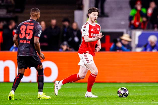 Declan Rice of Arsenal FC battles for possession with Christian Kofane of Bayer 04 Leverkusen Bayer 04 Leverkusen v Arsenal FC, UEFA Champions League 2025 26 Round of 16 First Leg, Bayer 04 Leverkusen v Arsenal FC, BayArena, March 11, 2026, Leverkusen, Germany.