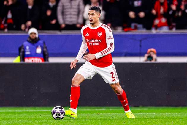William Saliba of Arsenal FC runs with the ball Bayer 04 Leverkusen v Arsenal FC, UEFA Champions League 2025 26 Round of 16 First Leg, Bayer 04 Leverkusen v Arsenal FC, BayArena, March 11, 2026, Leverkusen, Germany.