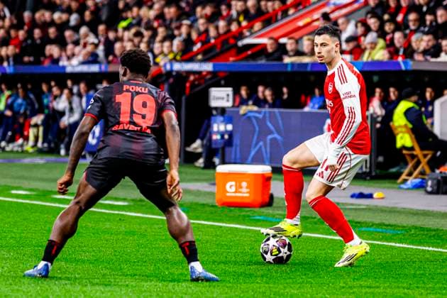 Gabriel Martinelli of Arsenal FC battles for possession with Ernest Poku of Bayer 04 Leverkusen Bayer 04 Leverkusen v Arsenal FC, UEFA Champions League 2025 26 Round of 16 First Leg, Bayer 04 Leverkusen v Arsenal FC, BayArena, March 11, 2026, Leverkusen, Germany.