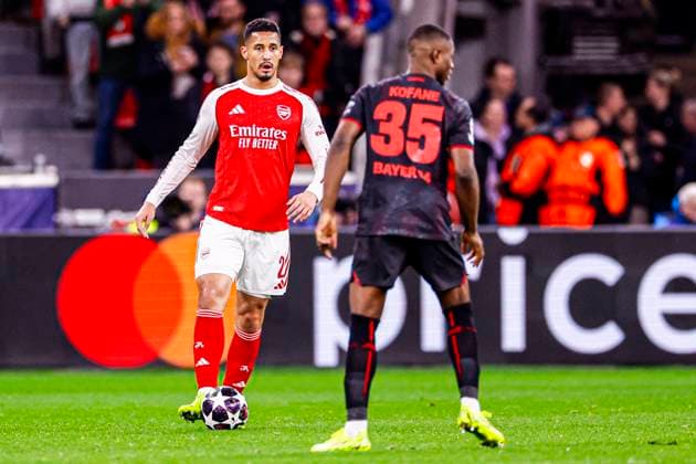 William Saliba of Arsenal FC runs with the ball Bayer 04 Leverkusen v Arsenal FC, UEFA Champions League 2025 26 Round of 16 First Leg, Bayer 04 Leverkusen v Arsenal FC, BayArena, March 11, 2026, Leverkusen, Germany.