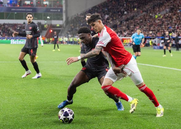 Leverkusen, Bayarena, 11 03 2026 Jarell Quansah of Leverkusen challenges Piero Hincapie of Arsenal during the Round 16 Championsleague match Bayer 04 Leverkusen vs FC Arsenal