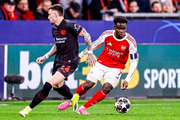 Bukayo Saka of Arsenal FC battles for possession with Aleix Garcia of Bayer 04 Leverkusen Bayer 04 Leverkusen v Arsenal FC, UEFA Champions League 2025 26 Round of 16 First Leg, Bayer 04 Leverkusen v Arsenal FC, BayArena, March 11, 2026, Leverkusen, Germany.