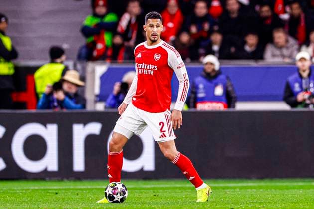 William Saliba of Arsenal FC runs with the ball Bayer 04 Leverkusen v Arsenal FC, UEFA Champions League 2025 26 Round of 16 First Leg, Bayer 04 Leverkusen v Arsenal FC, BayArena, March 11, 2026, Leverkusen, Germany.