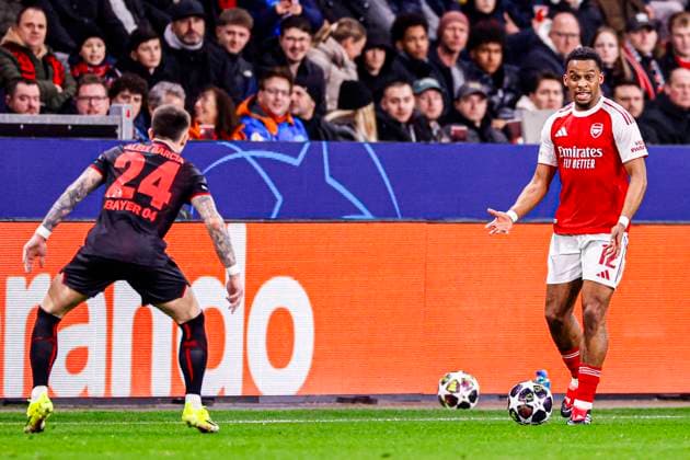 Jurrien Timber of Arsenal FC runs with the ball Bayer 04 Leverkusen v Arsenal FC, UEFA Champions League 2025 26 Round of 16 First Leg, Bayer 04 Leverkusen v Arsenal FC, BayArena, March 11, 2026, Leverkusen, Germany.