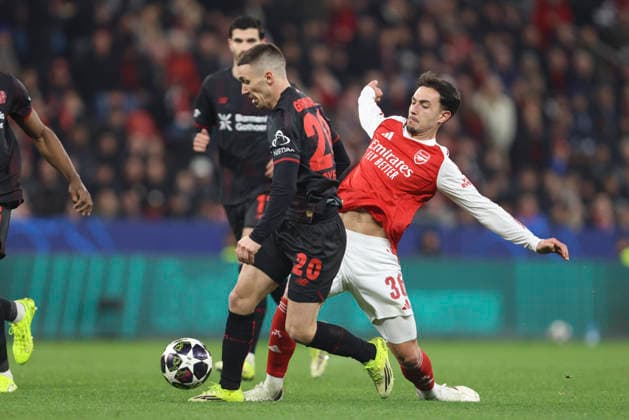 Alejandro Grimaldo Bayer 04 Leverkusen and Martin Zubimendi Arsenal FC battle for the ball during the UEFA Champions League 2025 26 Round of 16 First Leg match between Bayer 04 Leverkusen and Arsenal FC at BayArena on March 11, 2026 in Leverkusen, Germany Photo by Oliver Kaelke DeFodi Images