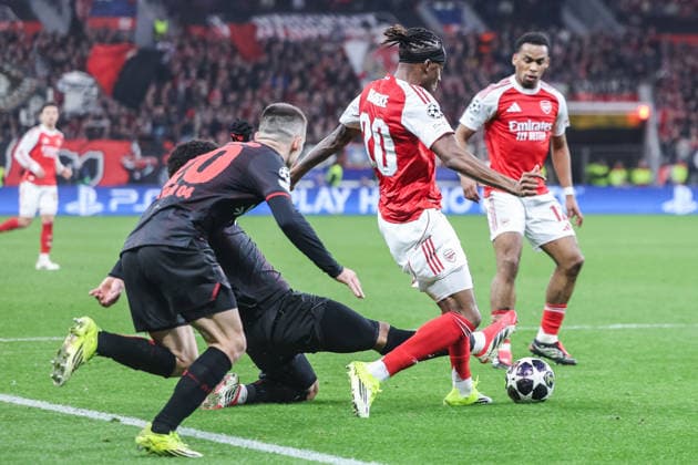 Soccer Champions League Round of 16 Bayer 04 Leverkusen FC Arsenal on 11 03 2026 at the BayArena in Leverkusen Malik Tillman Leverkusen , left fouls Noni Madueke Arsenal , right xJRx