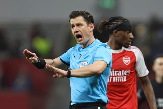 referee Halil Umut Meler gestures during the UEFA Champions League 2025 26 Round of 16 First Leg match between Bayer 04 Leverkusen and Arsenal FC at BayArena on March 11, 2026 in Leverkusen, Germany Photo by Oliver Kaelke DeFodi Images