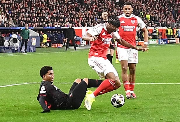 11 03 2026, xhbx, Football UEFA Champions League, Bayer 04 Leverkusen FC Arsenal London v l Malik Tillman Bayer Leverkusen , Noni Madueke Arsenal London FC , Foul leading to penalty goal by Kai Havertz Arsenal London FC DFL DFB REGULATIONS PROHIBIT ANY USE OF PHOTOGRAPHS as IMAGE SEQUENCES and or QUASI VIDEO Leverkusen