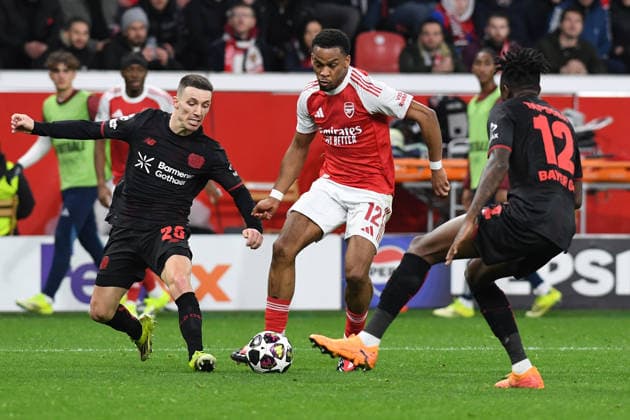 Alejandro Grimaldo Bayer 04 Leverkusen , Jurrien Timber FC Arsenal and Edmond Tapsoba Bayer 04 Leverkusen in a duel during the UEFA Champions League 2025 26 Round of 16, First Leg, match between Bayer 04 Leverkusen and FC Arsenal, BayArena on March 11, 2026 in Leverkusen, Germany Photo by Ralf Treese DeFodi Images Alejandro Grimaldo Bayer 04 Leverkusen , Jurrien Timber FC Arsenal and Edmond Tapsoba Bayer 04 Leverkusen battle for the ball during the UEFA Champions League 2025 26 Round of 16, First Leg, match between Bayer 04 Leverkusen and FC Arsenal at BayArena on February 24, 2026 in Leverkusen, Germany Photo by Ralf Treese DeFodi Images