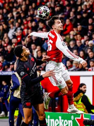 Martin Zubimendi of Arsenal FC heads the ball with Jarell Quansah of Bayer 04 Leverkusen Bayer 04 Leverkusen v Arsenal FC, UEFA Champions League 2025 26 Round of 16 First Leg, Bayer 04 Leverkusen v Arsenal FC, BayArena, March 11, 2026, Leverkusen, Germany.