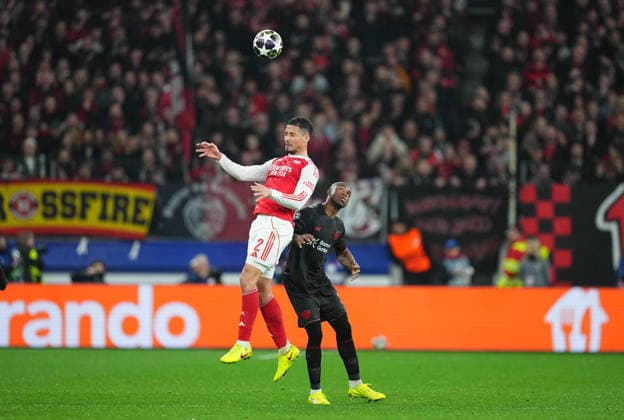William Saliba FC Arsenal and Christian Kofane Bayer 04 Leverkusen battle for the ball during Bayer Leverkusen and FC Arsenal at BayArena, Leverkusen, Germany on March 11, 2026 Thor Wegner DeFodi Images Photo by DeFodi Images