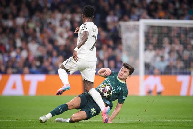 Real Madrid CF s Vinicius Junior (l) and Manchester City FC s Abdukodir Khusanov during Champions League 2025 2026 match. March 11,2026. (20260311013)