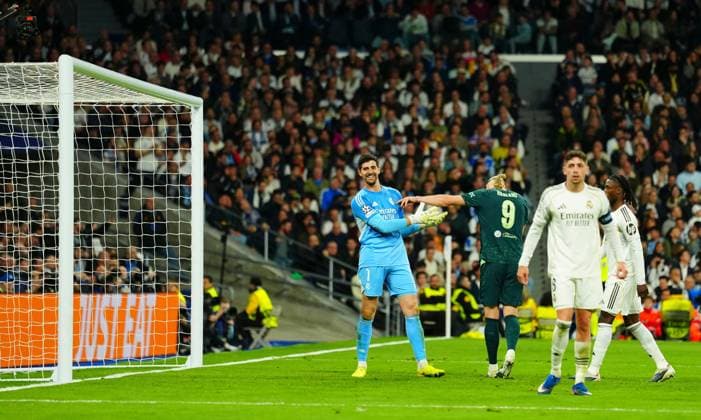 Erling Haaland of Manchester City playfully shoves Real Madrid Goalkeeper Thibaut Courtois after he saved from Nico O Reilly at 3-0 Real Madrid v Manchester City, UEFA Champions League, Round of 16, First Leg, Football, Bernabeu, Madrid, Spain - 11 Mar 2026Madrid Bernabeu Spain EDITORIAL USE ONLY No use with unauthorised audio, video, data, fixture lists, club league logos or live services. Online in-match use limited to 120 images, no video emulation. No use in betting, games or single club league player publications.  Copyright: xJavierxGarcia Shutterstockx 16746741aq