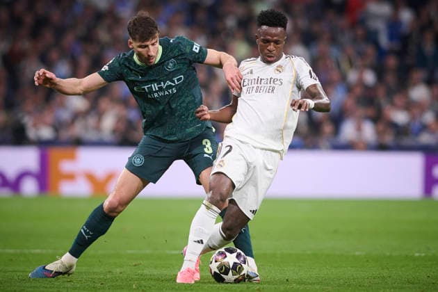 REAL MADRID CF v MANCHESTER CITY FC. CHAMPIONS LEAGUE 2025 2026. ROUND OF 16 FIRST LEG. Real Madrid CF s Vinicius Junior (r) and Manchester City FC s Ruben Dias during Champions League 2025 2026 match. March 11,2026. (ALTERPHOTOS Ropero) MadridSpain  Copyright: xRoperox