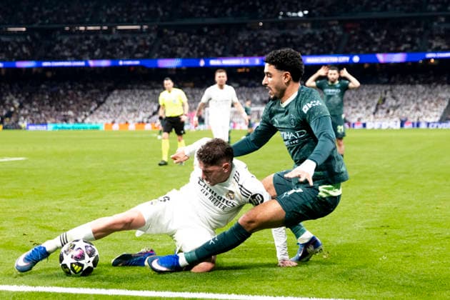 UEFA champions league - Real Madrid vs Manchester City MADRID, SPAIN - March 11:Federico Valverde of Real Madrid and Omar Marmoush of Manchester City in action during the UEFA champions league 2025 26 round of 16 first leg match between Real Madrid and Manchester City at Santiago Bernabeu Stadium. (Photo by Guille Martinez f22photo) Madrid Santiago Bernabeu Stadium Spain Copyright: xGuillermoxMartinezx
