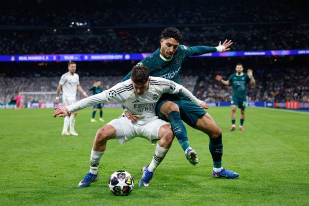 March 11, 2026, Madrid, Madrid, Spain: Federico Valverde of Real Madrid CF and Omar Marmoush of Manchester City compete for the ball during the UEFA Champions League 2025 26 Round of 16 First Leg match between Real Madrid C.F. and Manchester City at Bernabeu stadium on March 11, 2026, in Madrid, Spain. Madrid Spain - ZUMAa181 20260311_zaa_a181_168 Copyright: xDennisxAgyemanx