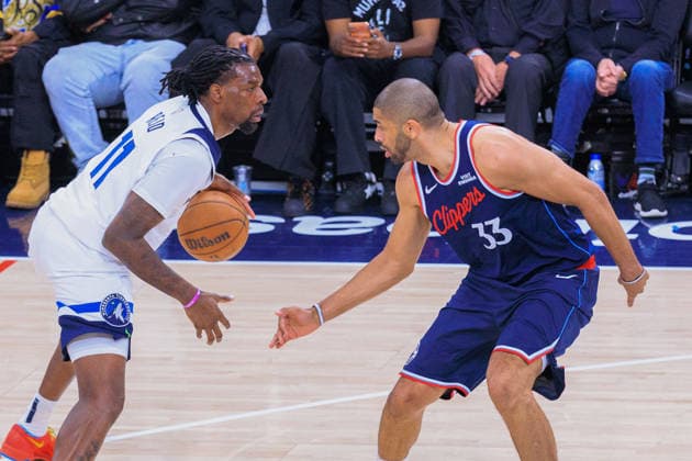 March 11, 2026, Inglewood, California, USA: Naz Reid 11 of the Minnesota Timberwolves is guarded by Nicolas Batum 33 of the LA Clippers during a 2026 NBA, Basketball Herren, USA regular season game on Wednesday March 11, 2026 at Intuit Dome Arena in Inglewood, California. JAVIER ROJAS PI Inglewood USA - ZUMAp124 20260311_zaa_p124_055 Copyright: xJavierxRojasx