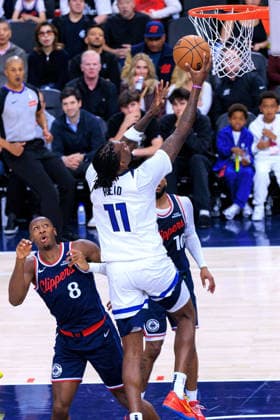 March 11, 2026, Inglewood, California, USA: Naz Reid 11 of the Minnesota Timberwolves puts a layup past Kris Dunn 8 of the LA Clippers during a 2026 NBA, Basketball Herren, USA regular season game on Wednesday March 11, 2026 at Intuit Dome Arena in Inglewood, California. JAVIER ROJAS PI Inglewood USA - ZUMAp124 20260311_zaa_p124_058 Copyright: xJavierxRojasx