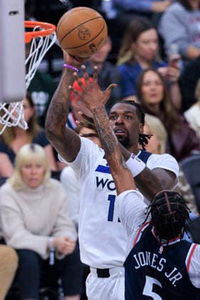 March 11, 2026, Inglewood, California, USA: Naz Reid 11 of the Minnesota Timberwolves scores with a floater as Derrick Jones Jr. 5 of the Los Angeles Clippers defends the basket during their regular season NBA, Basketball Herren, USA game on Wednesday March 11, 2026 at Intuit Dome in Inglewood, California. ARIANA RUIZ PI Inglewood USA - ZUMAp124 20260311_zaa_p124_069 Copyright: xArianaxRuizx