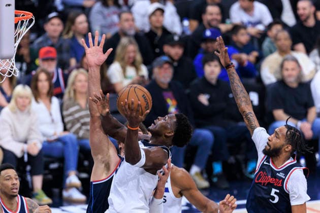 March 11, 2026, Inglewood, California, USA: Anthony Edwards 5 of the Minnesota Timberwolves makes a two point shot as Brook Lopez 11 and Derrick Jones Jr. 5 of the Los Angeles Clippers defend the basket during their regular season NBA, Basketball Herren, USA game on Wednesday March 11, 2026 at Intuit Dome in Inglewood, California. ARIANA RUIZ PI Inglewood USA - ZUMAp124 20260311_zaa_p124_078 Copyright: xArianaxRuizx
