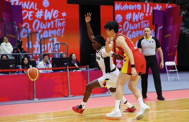 Belgium s Bethy Mununga and China Mingling Chen fight for the ball during a basket game between China and Belgium s national team, Nationalteam Belgian Cats, in Wuhan, China, on Thursday 12 March 2026, the second game (out of 5) of the qualifications phase for the World Cup Basket tournament. NIKOLAxKRSTIC  x167247575x