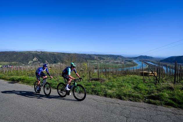 Russian Aleksandr Vlasov of Red Bull-BORA-hansgrohe and French Nicolas Prodhomme of Decathlon CMA CGM Team pictured in action during the fifth stage of 84th edition of the Paris-Nice cycling race, a race from Cormoranche-sur-Saone to Colombier-le-Vieux (205,4km), on Thursday 12 March 2026. DAVIDxPINTENS  x167269223x