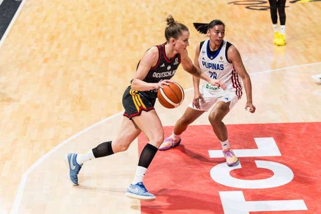 LYON-VILLEURBANNE, FRANCE - MARCH 12: Leonie Fiebich (Germany, 13) controls the ball against Kacey Dela Rosa (Philippines, 28) during the FIBA Women™s World Cup Qualifying Tournament match between Philippines (PHI) vs. Germany (GER) at Astroballe on matchday 2 of the FIBA Women™s World Cup Qualifying Tournament on March 12, 2026 in Lyon-Villeurbanne, France. France Copyright: xSteffiexWunderlx