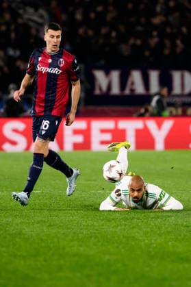 Nicolo Casale of Bologna FC and Donyell Malen of AS Roma during the UEFA Europa League 2025 2026 football match between Bologna FC 1909 and AS Roma at Renato Dall Ara Stadium in Bologna (Italy), March 12, 2026. andreaxstaccioli