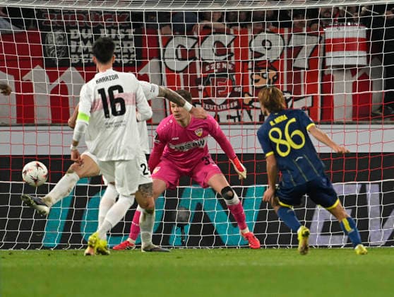 12 03 2026, Football UEFA Europa League 2025 2026 Round of 16, VfB Stuttgart FC Porto, in the MHP Arena Stuttgart, Rodrigo Mora FC Porto scores to 0 2 against goalkeeper Alexander Nübel Stuttgart DFL and DFB regulations prohibit any use of photographs as image sequences and or quasi video