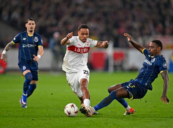 12 03 2026, Football UEFA Europa League 2025 2026 Round of 16, VfB Stuttgart FC Porto, in the MHP Arena Stuttgart, f l Borja Sainz FC Porto , Nikolas Nartey Stuttgart and Pablo Rosario FC Porto in a duel DFL and DFB regulations prohibit any use of photographs as image sequences and or quasi video