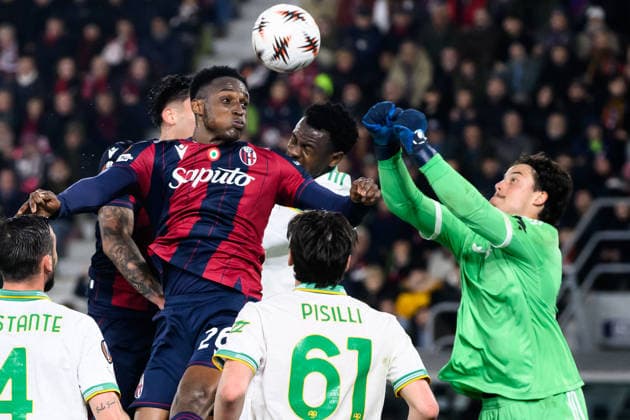 Mile Svilar of AS Roma saves on Jhon Lucumi of Bologna FC during the UEFA Europa League 2025 2026 football match between Bologna FC 1909 and AS Roma at Renato Dall Ara Stadium in Bologna (Italy), March 12, 2026. andreaxstaccioli