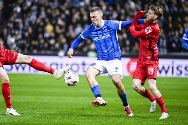 Genk s Daan Heymans and Freiburg s Niklas Beste pictured in action during a game between Belgian soccer team KRC Genk and German Freiburg, Thursday 12 March 2026 in Genk, the first leg of the 1 16 Finals of the UEFA Europa League tournament. TOM GOYVAERTS TomxGoyvaerts  x167296692x