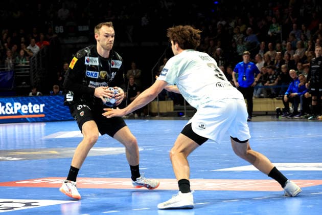 DEU, Machineseeker EHF Champions League, Fuechse Berlin vs HBC Nantes, 12 03 2026, Max Schmeling Halle, Berlin, DEU, Machineseeker EHF Champions League, Fuechse Berlin vs HBC Nantes, in the picture Mathias Gidsel Fuechse Berlin 19 , Thibaud Briet HBC Nantes 3 nordphotoxGmbHx xEngler nph00076
