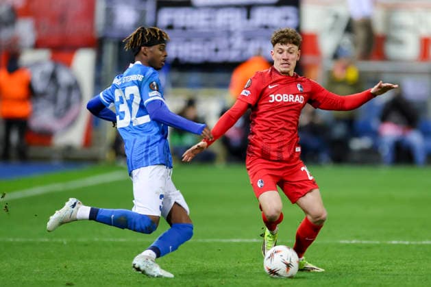Noah Adedeji Sternberg KRC Genk and Philipp Treu SC Freiburg battle for the ball, UEFA Europa League 2025 26 Round of 16 First Leg, KRC Genk v SC Freiburg, Cegeka Arena on March 12, 2026 in Genk, Belgium Photo by Marco Steinbrenner DeFodi Images Noah Adedeji Sternberg KRC Genk and Philipp Treu SC Freiburg battle for the ball, UEFA Europa League 2025 26 Round of 16 First Leg, KRC Genk v SC Freiburg, Cegeka Arena, March 12, 2026 in Genk, Belgium Photo by Marco Steinbrenner DeFodi Images