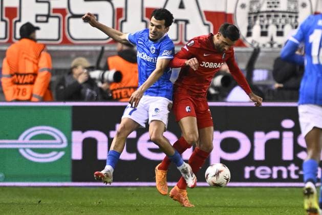 Genk s Zakaria El Ouahdi and Freiburg s Vincenzo Grifo fight for the ball during a game between Belgian soccer team KRC Genk and German Freiburg, Thursday 12 March 2026 in Genk, the first leg of the 1 16 Finals of the UEFA Europa League tournament. JOHAN EYCKENS JohanxEyckens  x167302329x