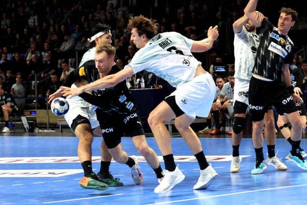 DEU, Machineseeker EHF Champions League, Fuechse Berlin vs HBC Nantes, 12 03 2026, Max Schmeling Halle, Berlin, DEU, Machineseeker EHF Champions League, Fuechse Berlin vs HBC Nantes, in the picture Mathias Gidsel Fuechse Berlin 19 , Shuichi Yoshida HBC Nantes 5 , Thibaud Briet HBC Nantes 3 nordphotoxGmbHx xEngler nph00076