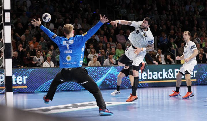 Nicolas Toutnat scores a goal against goalkeeper Lasse Ludwig duel Game scene Action Sport Handball CL Champions League Champions League Men 14 Matchday Season 2025 2026 12 03 2026 Füchse Berlin vs HBC Nantes in the Max Schmeling Halle