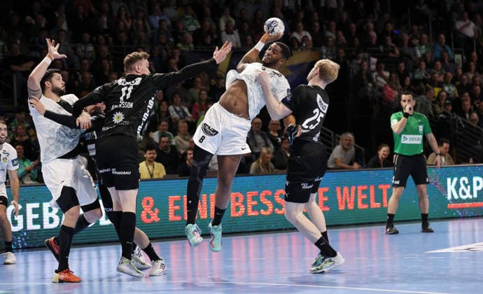 Nicolas Toutnat, Lasse Andersson, O Brien Nyateu on the ball, Matthes Langhoff duel Match scene Action Sport Handball CL Champions League Champions League Men 14 Matchday Season 2025 2026 12 03 2026 Füchse Berlin vs HBC Nantes in the Max Schmeling Halle