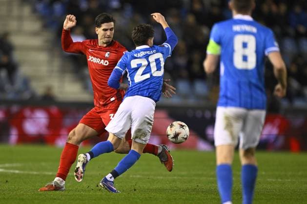 Freiburg s Igor Matanovic and Genk s Konstantinos Kos Karetsas fight for the ball during a game between Belgian soccer team KRC Genk and German Freiburg, Thursday 12 March 2026 in Genk, the first leg of the 1 16 Finals of the UEFA Europa League tournament. JOHAN EYCKENS JohanxEyckens  x167305576x