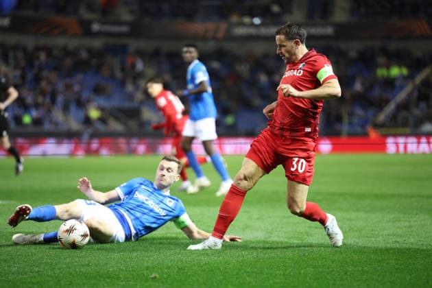 12 03 2026, xrekx, Football UEFA Europa League, KRC Genk SC Freiburg v l Bryan Heynen KRC Genk Christian Günter Guenter SC Freiburg Zweikampf, Aktion, action, battle for the ball DFL DFB REGULATIONS PROHIBIT ANY USE OF PHOTOGRAPHS as IMAGE SEQUENCES and or QUASI VIDEO Genk