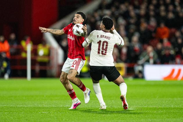 12th March 2026; The City Ground, Nottingham, England; UEFA Europa League Football, Nottingham Forest versus Midtjylland; Morgan Gibbs-White of Nottingham Forest handles the ball with his arm ahead of Pedro Bravo of FC Midtjylland  GodfreyxPitt Content restricted for UK based newspaper
