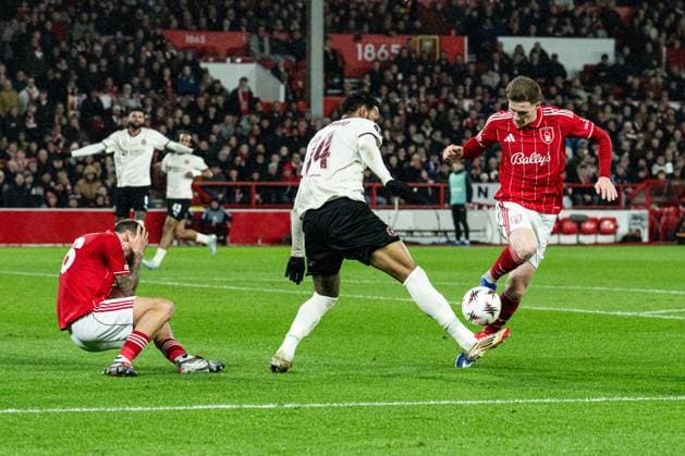 12th March 2026; The City Ground, Nottingham, England; UEFA Europa League Football, Nottingham Forest versus Midtjylland; Junior Brumado of FC Midtjylland fouls Elliot Anderson of Nottingham Forest after colliding with Nicolas Dominguez of Nottingham Forest  GodfreyxPitt Content restricted for UK based newspaper